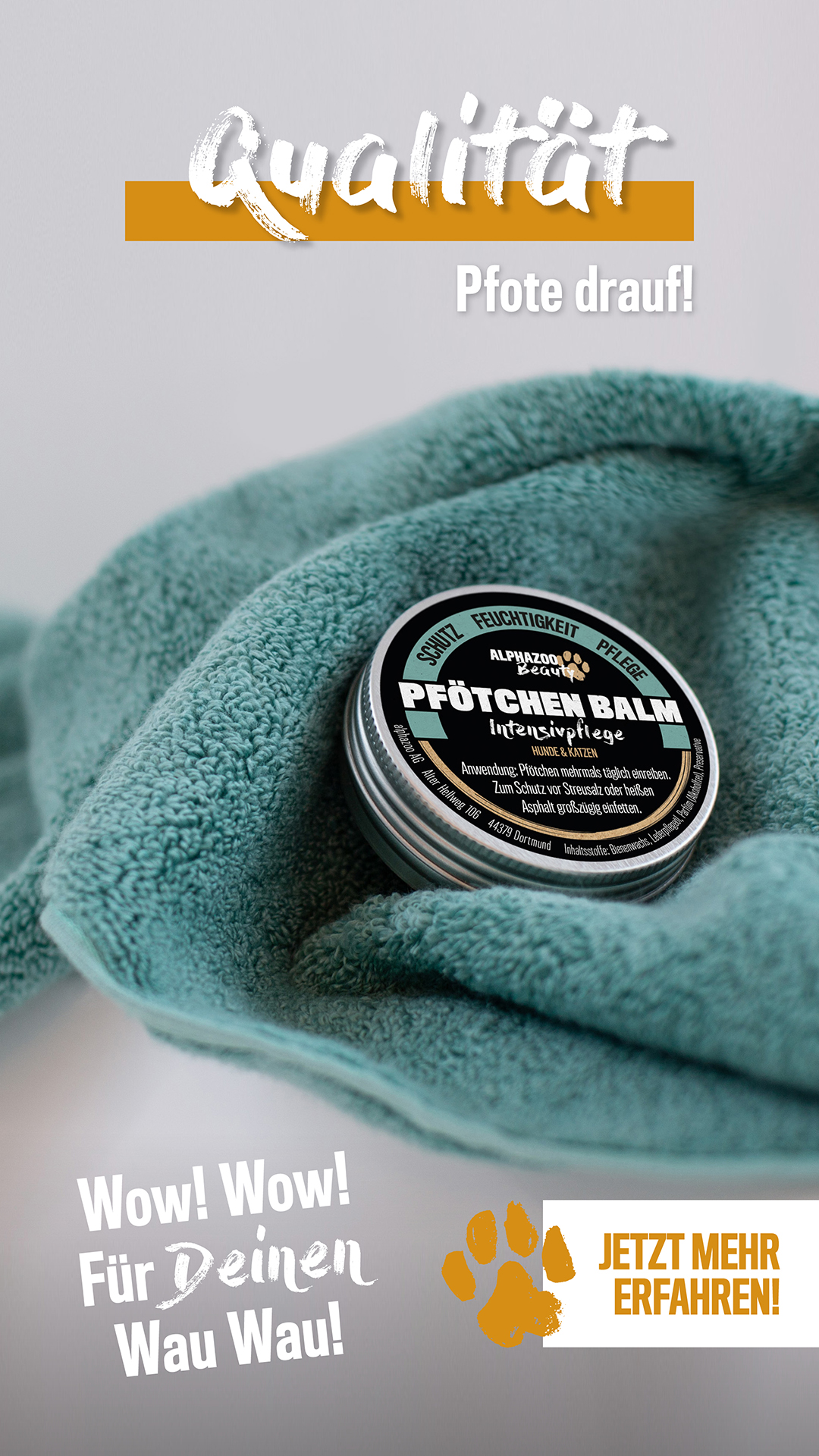 Produkt Pfötchenbalsam von ALPHAZOO auf einem Handtuch, Text 'Qualität, Pfote drauf!', 'Wow! Für deinen Wau Wau!', 'Jetzt mehr erfahren!